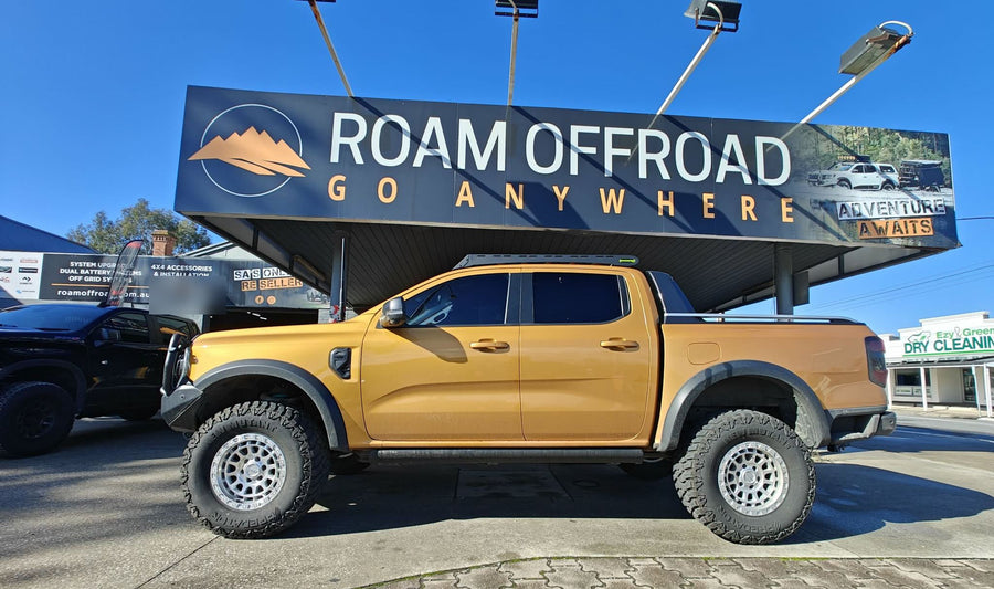 Lifted Ford Ranger with flares and snorkel under the Roam Offroad sign