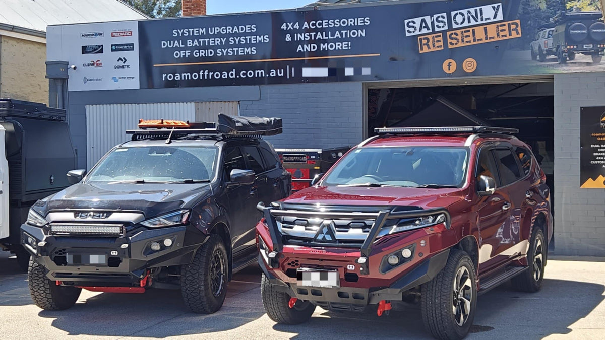 Isuzu D-MAX and Mitsubishi with bull bars fitted, parked outside Roam Offroad in Gawler South