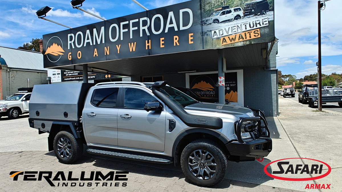 Ford Ranger with a Teralume tray and canopy and a Safari snorkel, outside the Roam Offroad shop