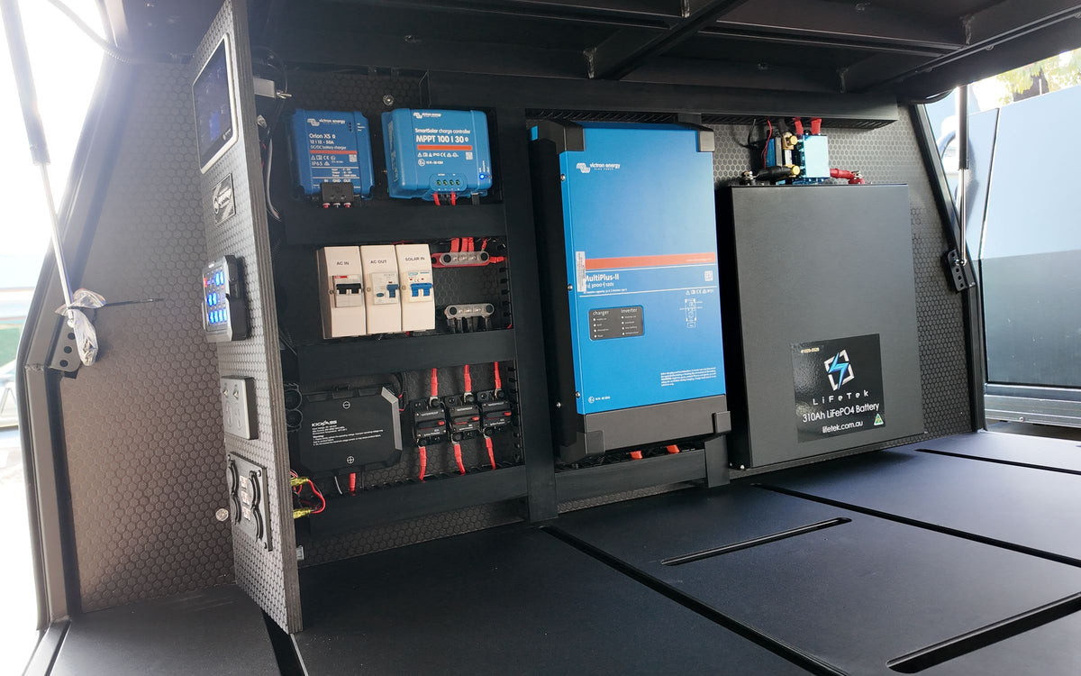 Canopy power wall with a Victron display, switch panel, outlets and a lithium battery