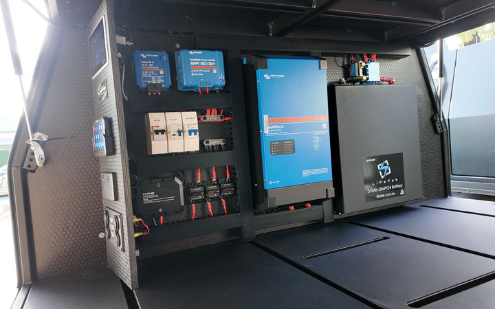 Canopy power wall with a Victron display, switch panel, outlets and a lithium battery