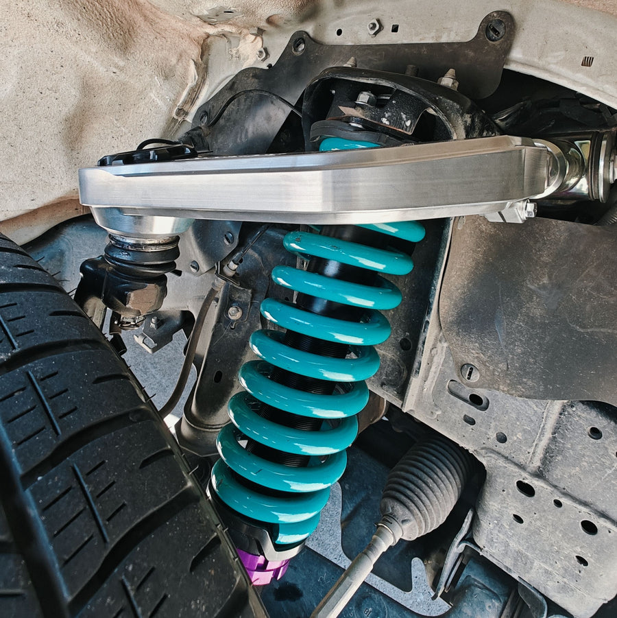 Coilover and upper control arm fitted to a 4WD