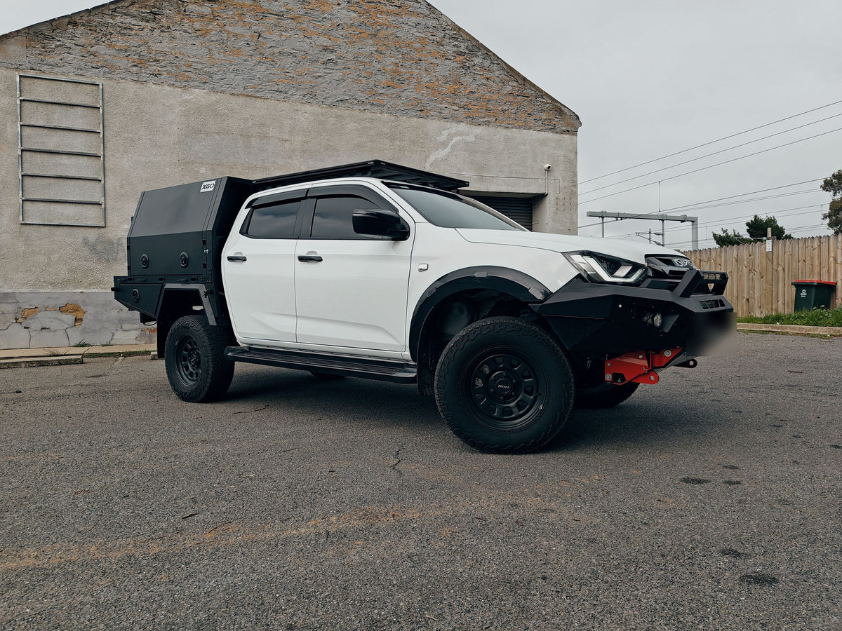 White Isuzu D-Max with a black canopy, tray and bull bar