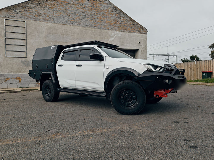 White Isuzu D-Max with a black canopy, tray and bull bar