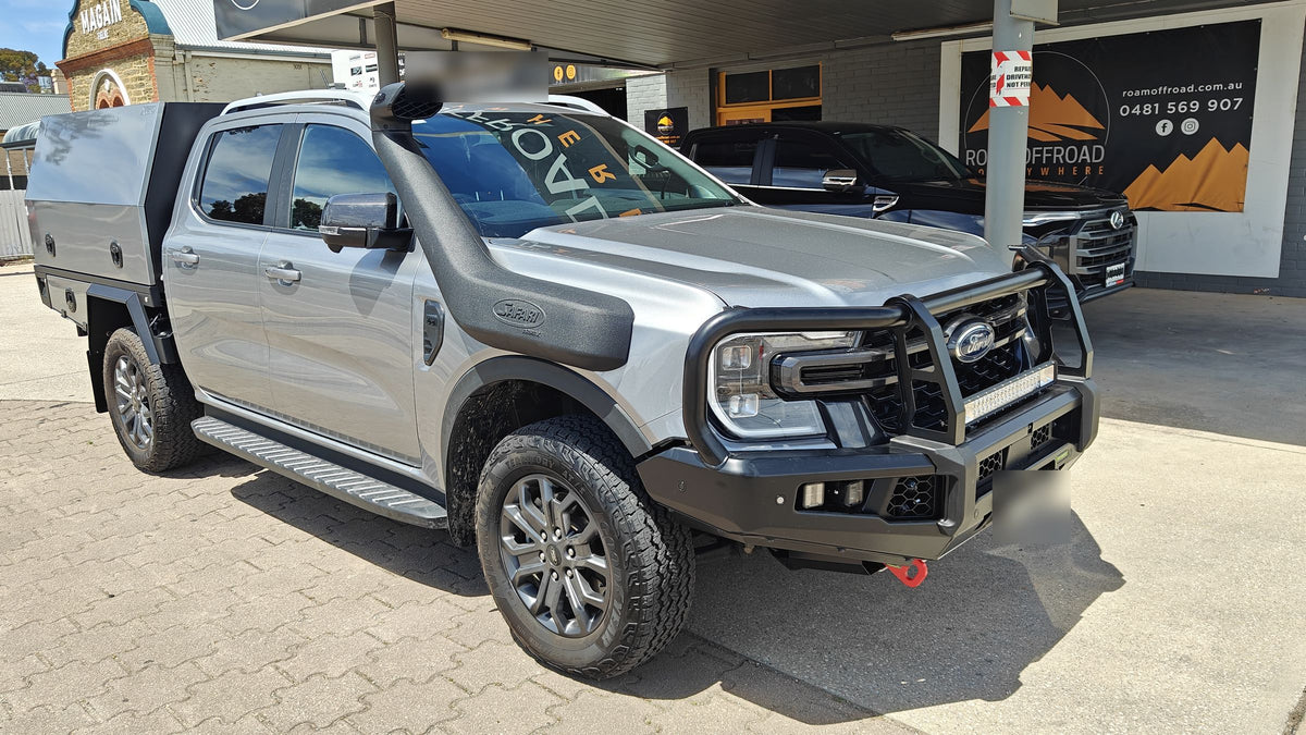 Silver Ford Ranger with a Hamer bull bar, light bar, canopy and snorkel