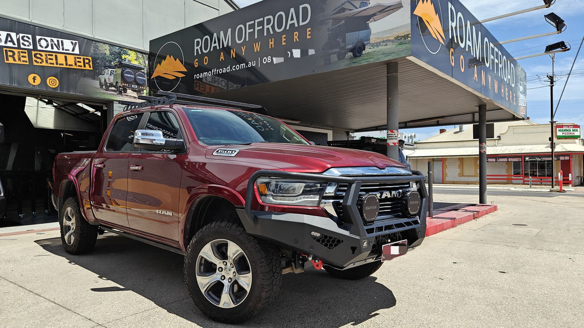 Red RAM 1500 with an Offroad Animal bull bar outside the shop
