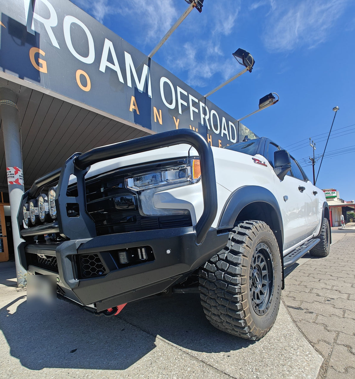 White Chevrolet Silverado with an Ironman 4x4 bull bar