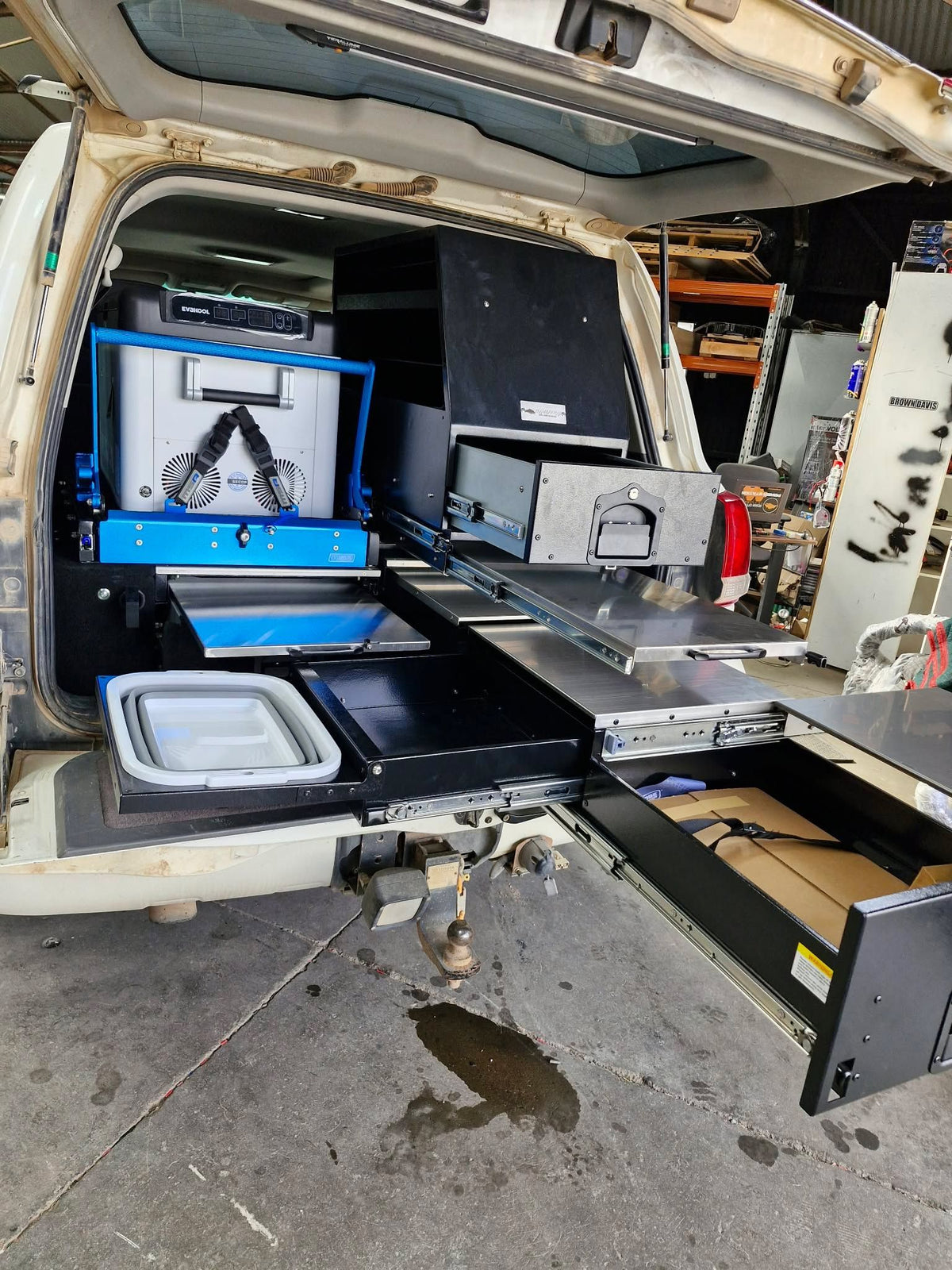 Drawers and fridge slide extended, seen from the tailgate